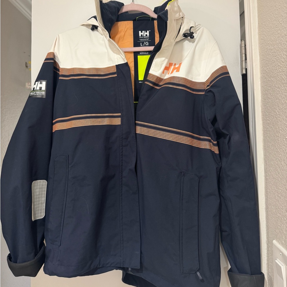 Helly Hansen Navy/ White Jacket with Vibrant orange Interior. Like New !